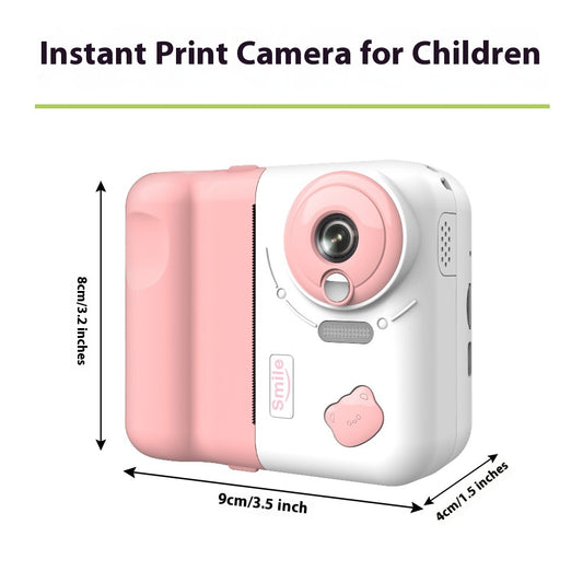 Pink instant print camera for children with dimensions displayed