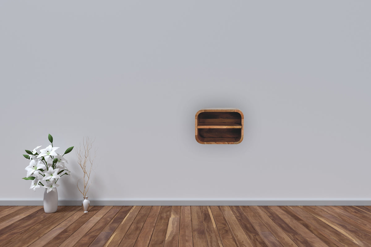 Oak-ish floating open curve nightstand with 2 open shelves. Wall-mounted and solid mango wood. Mounted on the wall in a living space.