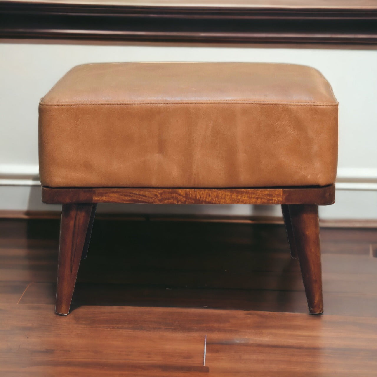 Tan Buffalo Leather Footstool with solid mango wood legs in chestnut finish. Detailed front view