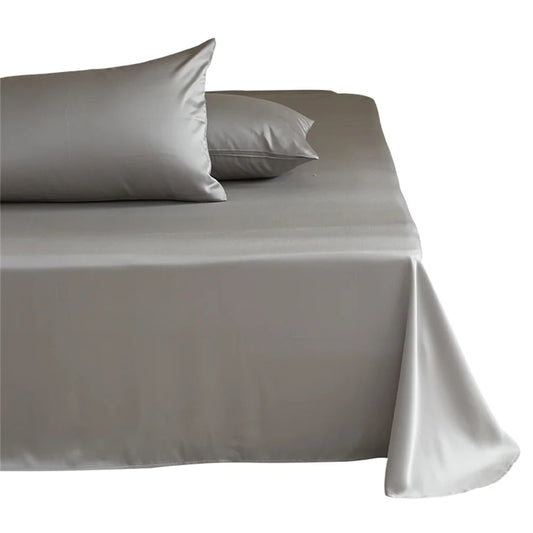 Gray satin sheet set on a bed with white background