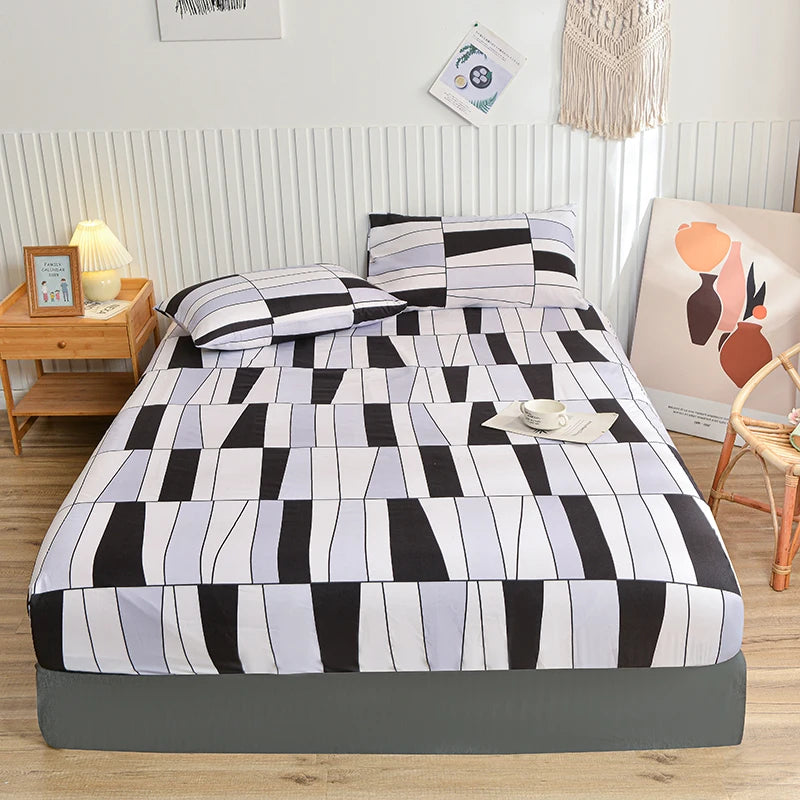 Bed with geometric patterned bedding in a bedroom setting