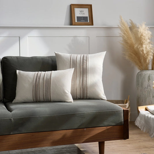 Gray sofa with decorative pillows in a living room setting