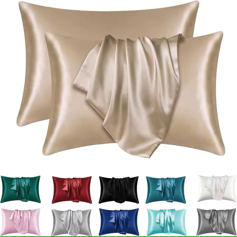 Set of satin pillowcases in various colors on a white background