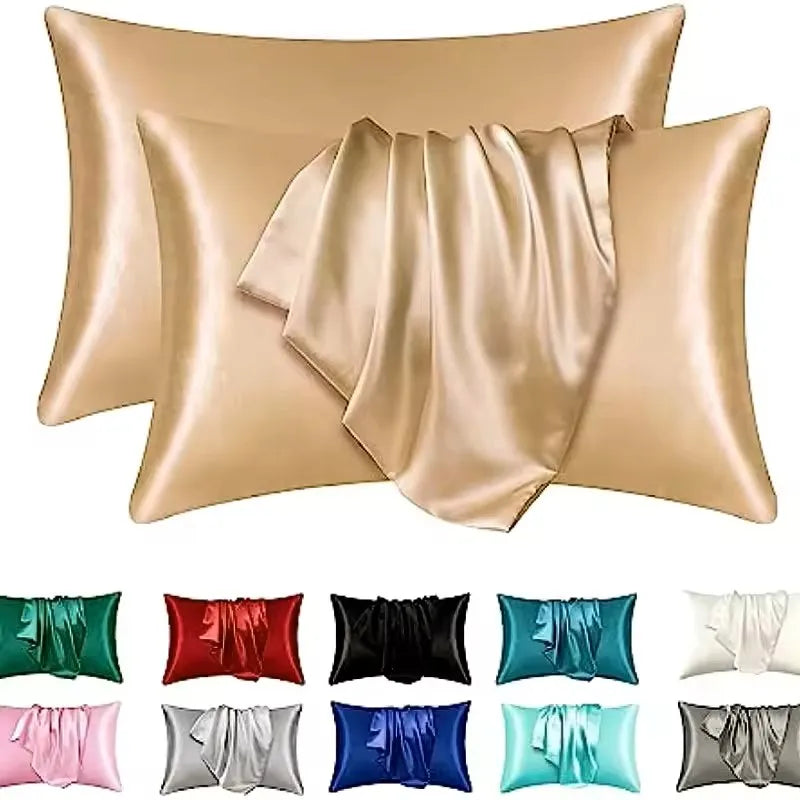 Gold satin pillowcases with color swatches below on a white background