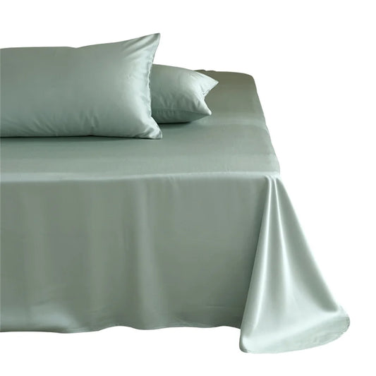 Set of light gray satin sheets and pillowcases on a bed with a white background