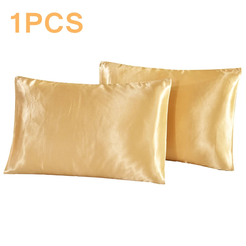 Two gold satin pillowcases on a white background with '1PCS' text above.