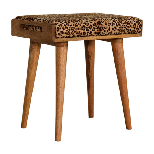 Leopard print velvet tray style footstool on hardwood floor