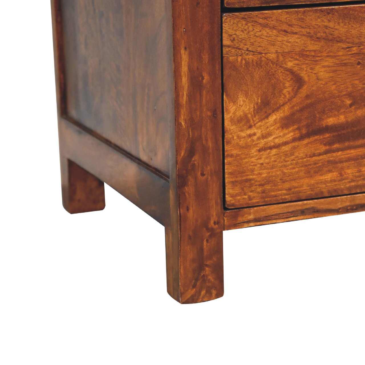Naya Chestnut Nightstand made from solid mango wood with three drawers and brass knobs. Foot view