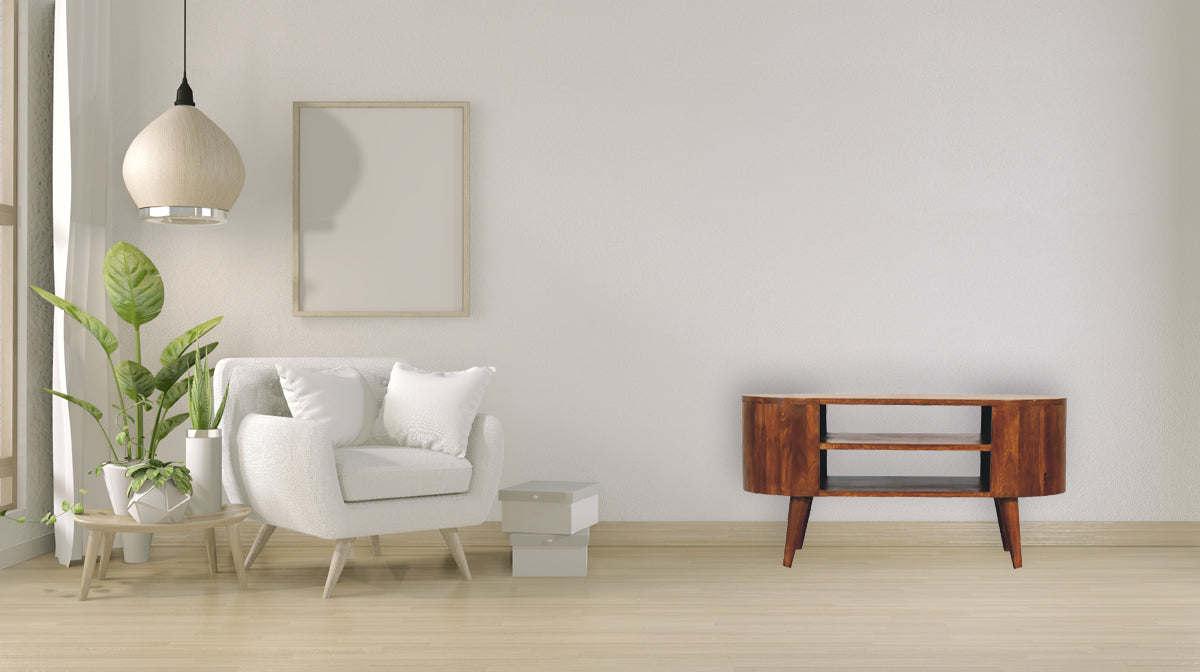 Cortez Chestnut Media Unit made from solid mango wood with two open shelves and chestnut finish. Full view in a living space