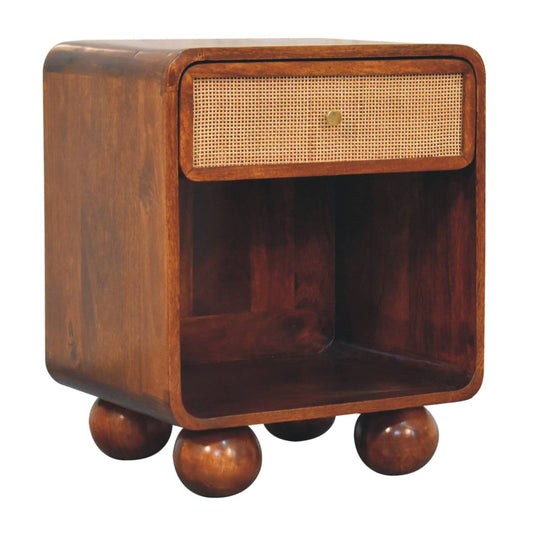 Chestnut woven chest with single drawer, shiny knob, and solid mango wood legs. Corner view