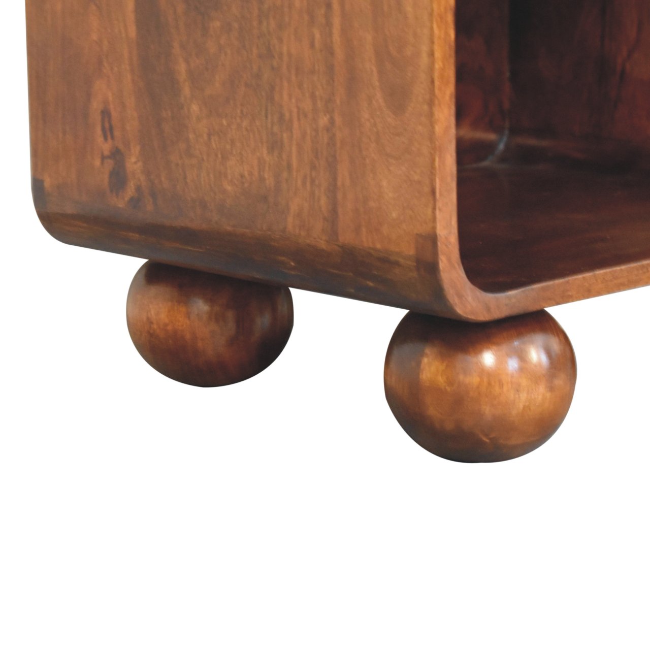 Chestnut woven chest with single drawer, shiny knob, and solid mango wood legs. Ball foot view