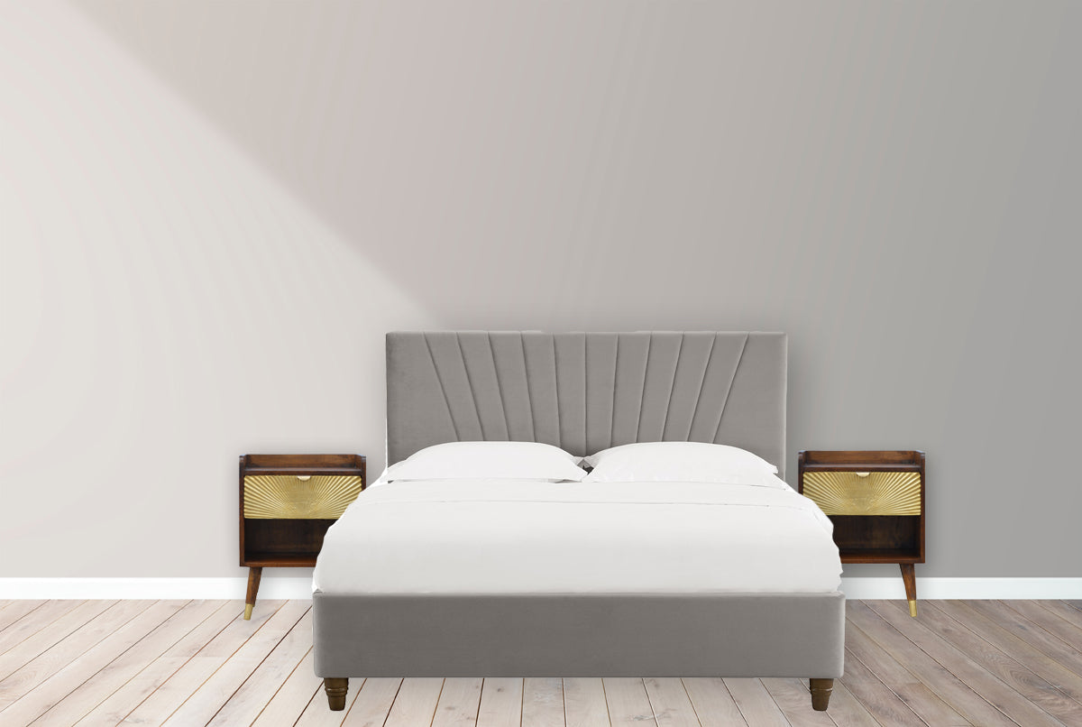 Manila Gold Chestnut Nightstand with brass plated drawer, open slot, and Nordic style legs. Positioned by the bedside