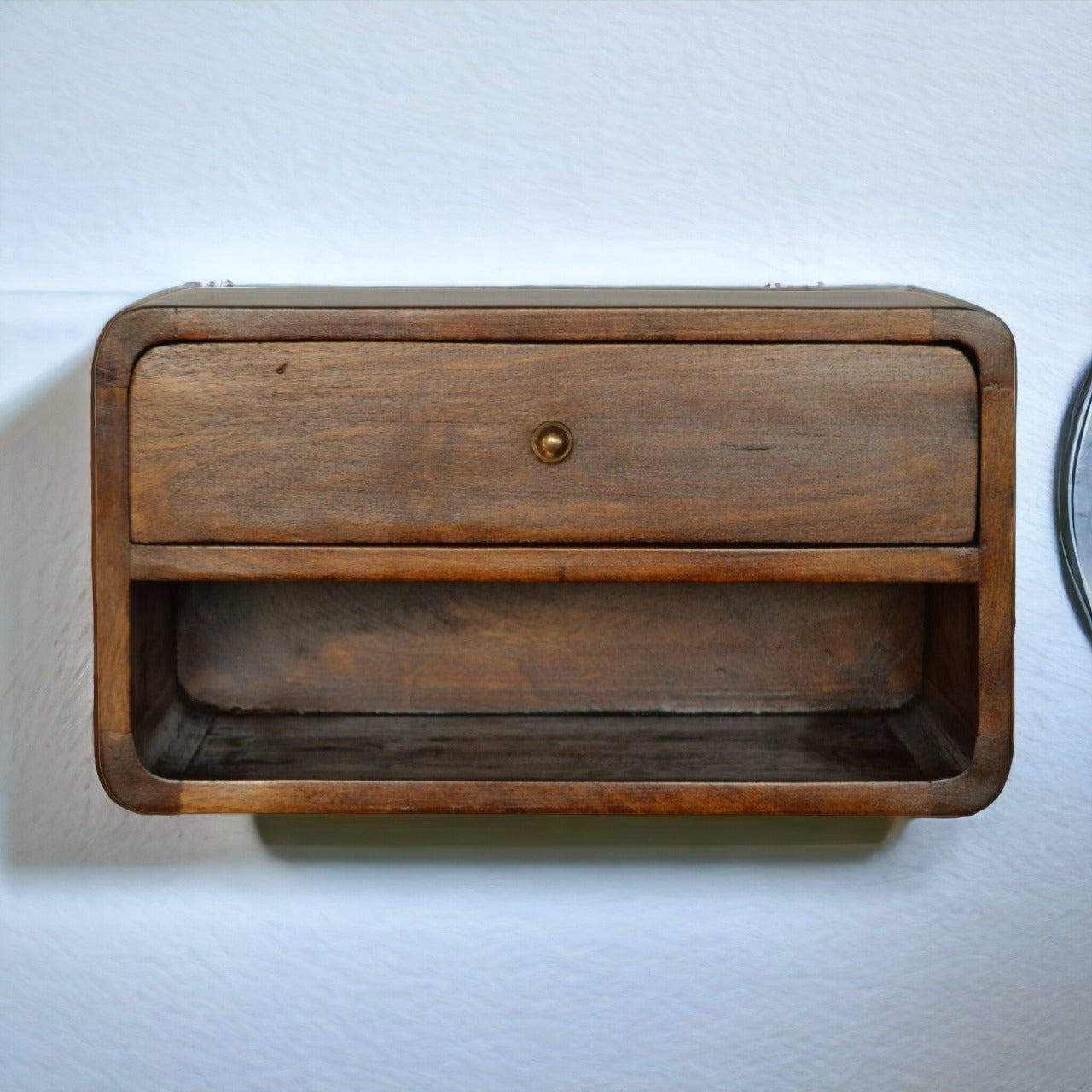 Floating chestnut nightstand with curved edges, wall-mounted modern design. Mounted on a wall view