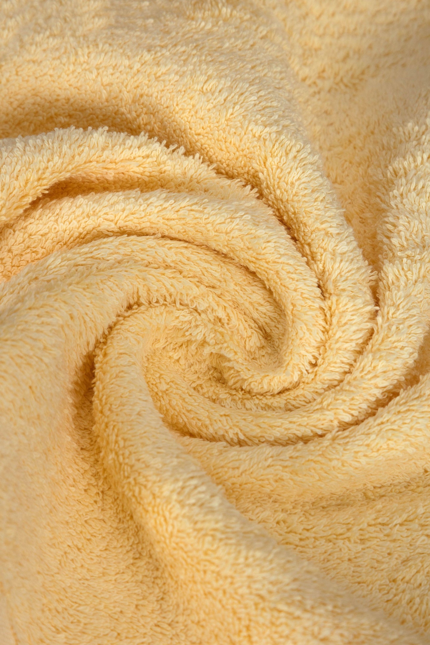 Close-up of a beige towel with a spiral pattern