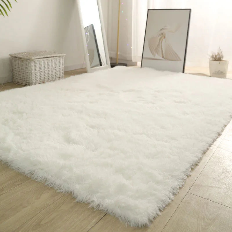 White fluffy rug on a wooden floor with a neutral decor background