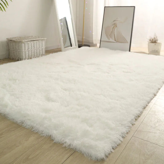White fluffy rug on a wooden floor with a neutral decor background