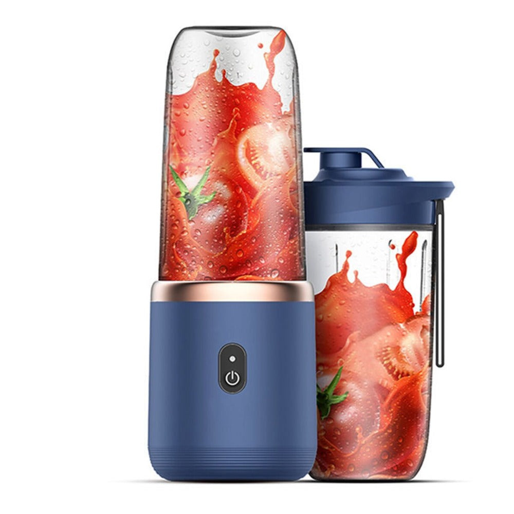 Blue portable blender with a container featuring a tomato and basil design on a white background