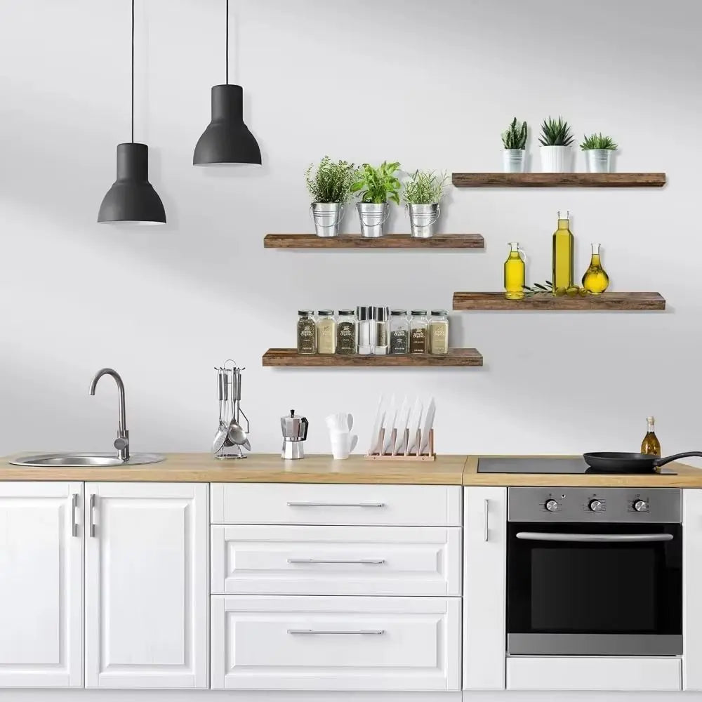 Modern kitchen with white cabinets, wooden countertops, and decorative shelves.