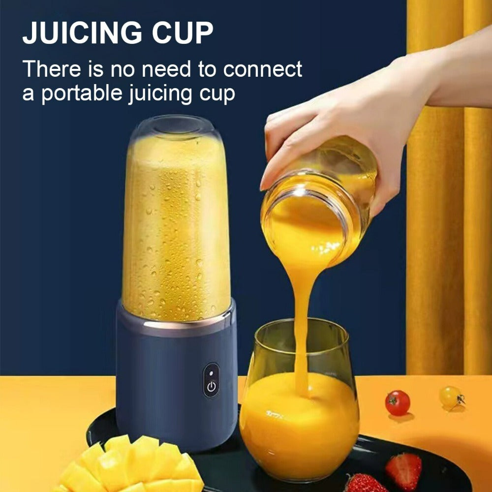 Portable juicer with a juicing cup being used to pour orange juice into a glass.