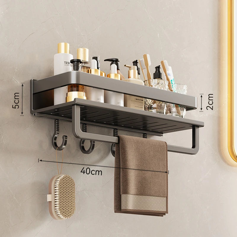 Bathroom shelf with towel bar, hooks, and toiletries on a neutral wall.