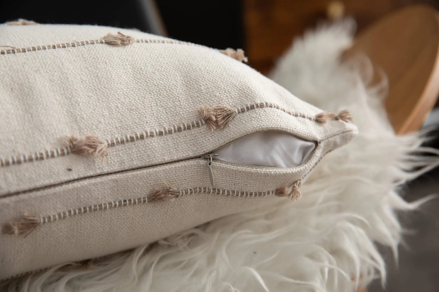 Decorative pillow with tufted details on a soft surface