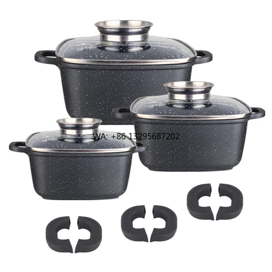 Set of black speckled cookware with lids on a white background