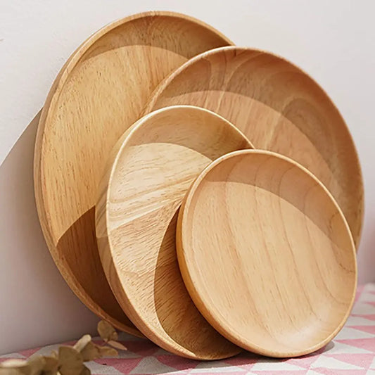 Set of wooden plates stacked on a checkered tablecloth