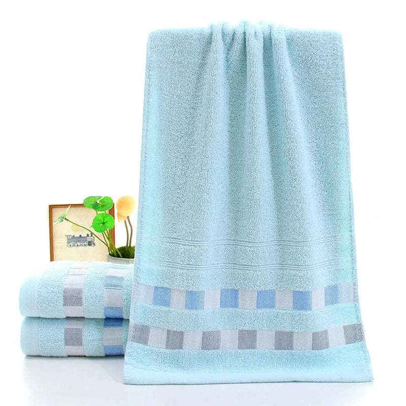 Light blue towels with a striped pattern on a white background