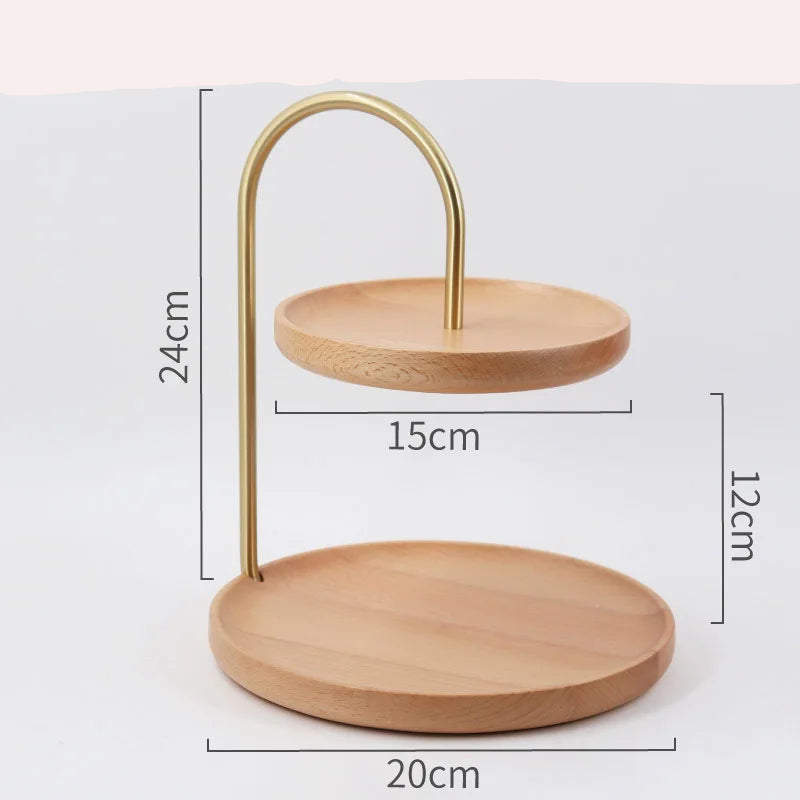Wooden two-tiered stand with gold metal arch, showing dimensions on a white background.