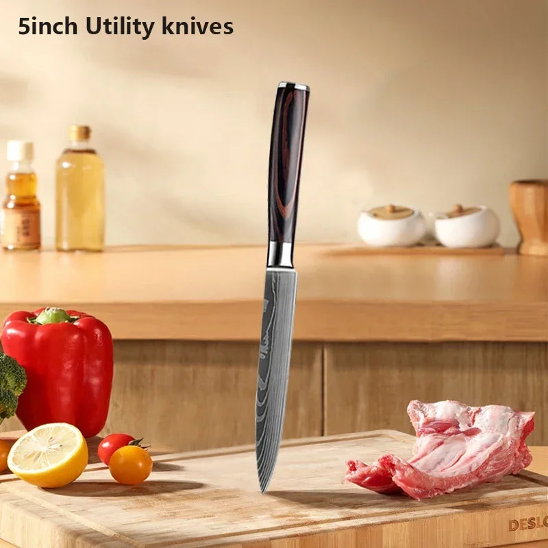5-inch utility knife on a kitchen counter with vegetables and meat
