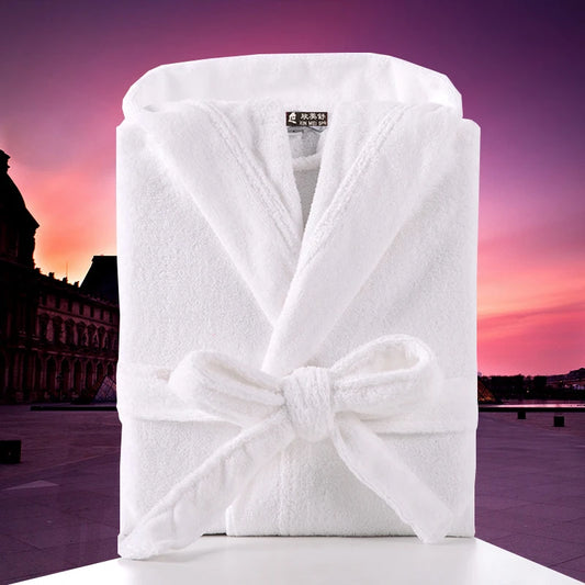 White robe with a bow in front of a blurred background with a sunset.