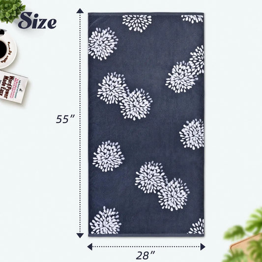 Navy blue towel with white floral patterns and measurements on a white background