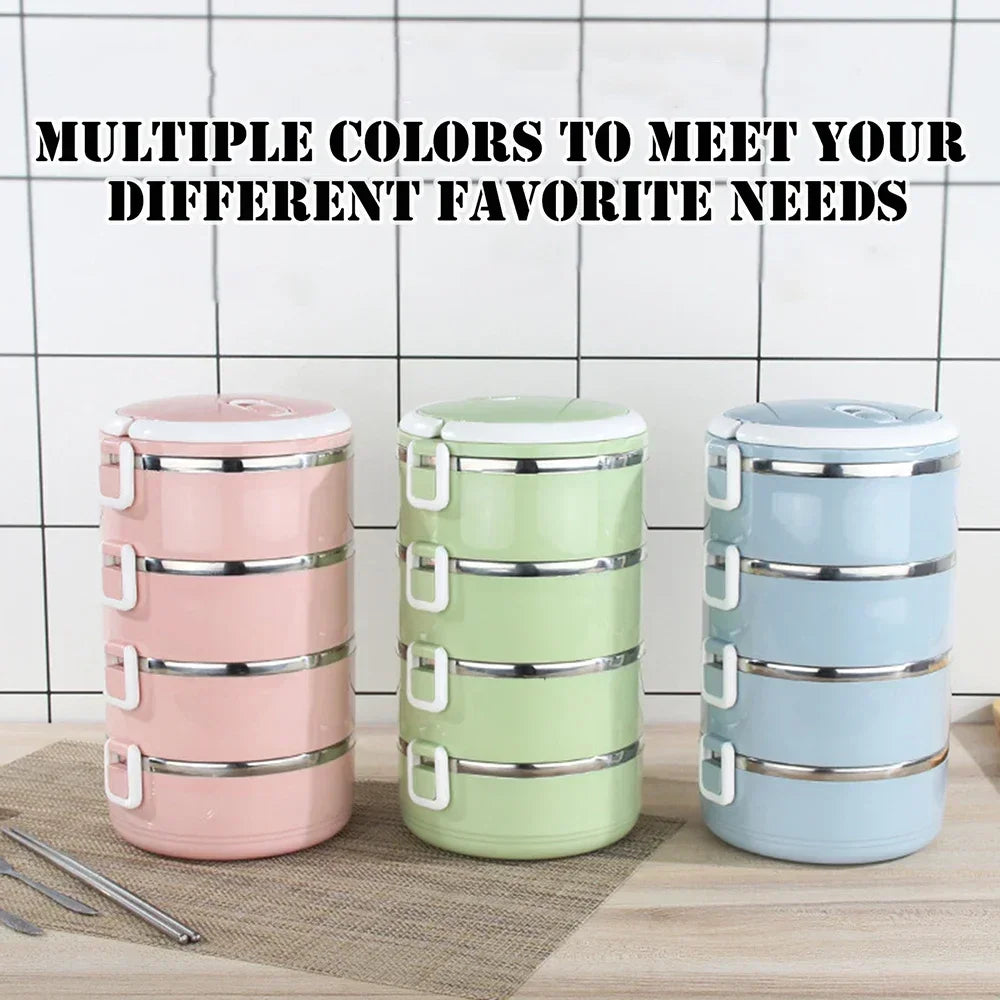 Three stackable containers in pink, green, and blue on a tiled kitchen counter.