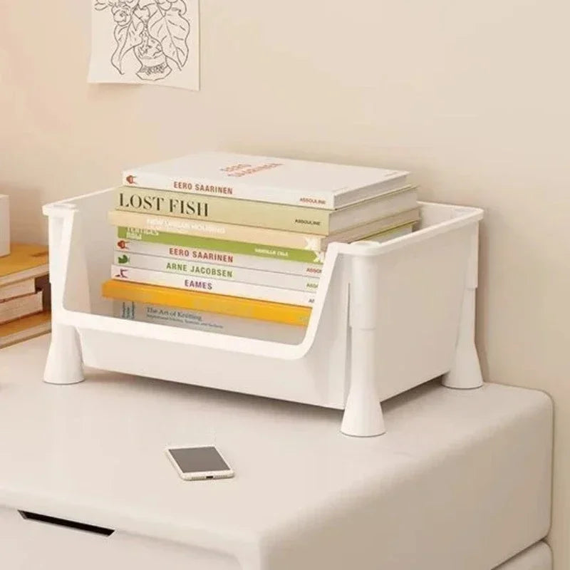 White bookshelf with books on a light-colored surface