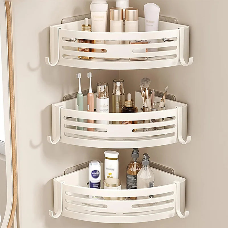 White corner shower caddy with various toiletries on a beige wall.