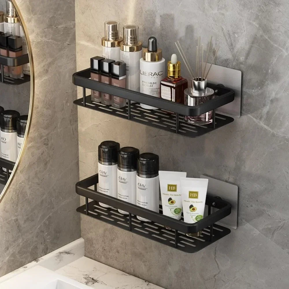Bathroom shelf with skincare products against a gray tiled wall