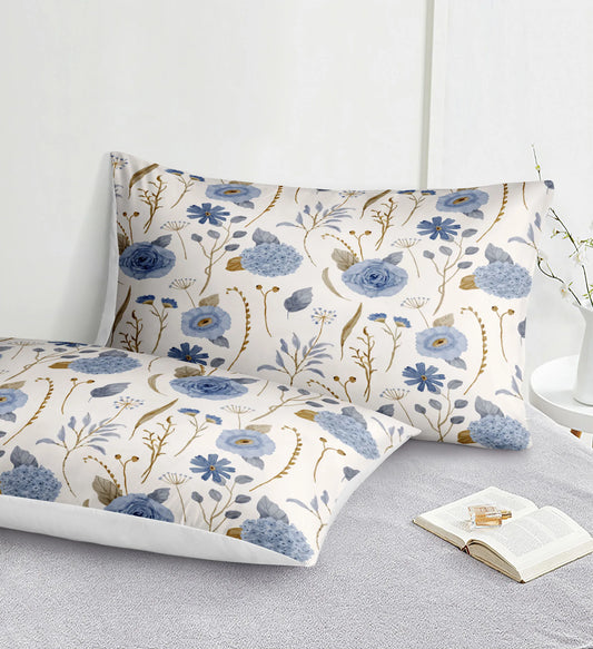 Floral patterned pillowcases on a bed with an open book.