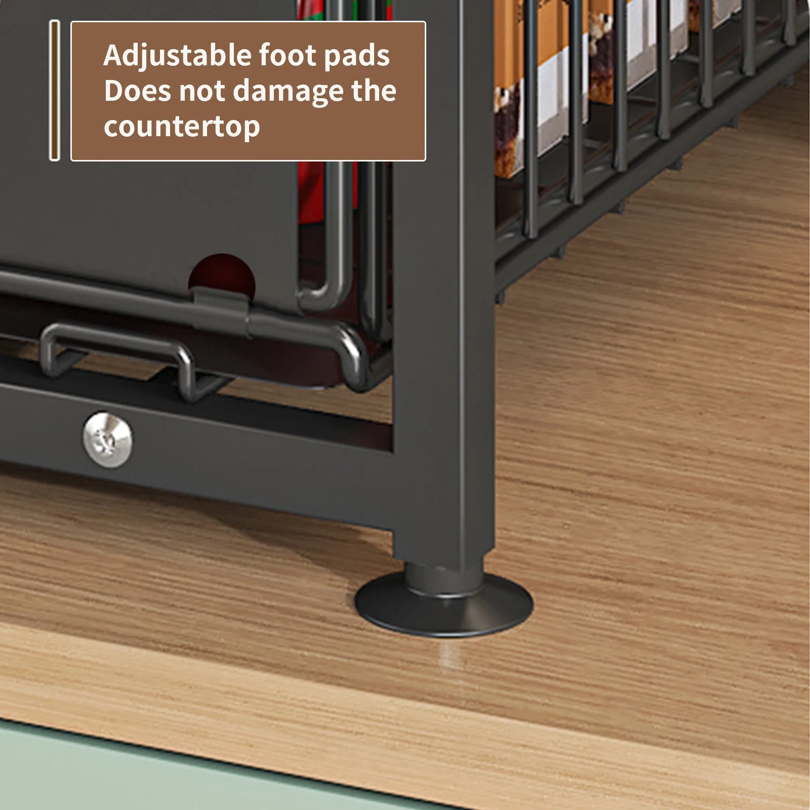 Adjustable foot pad on a kitchen cabinet with text indicating it does not damage countertops.