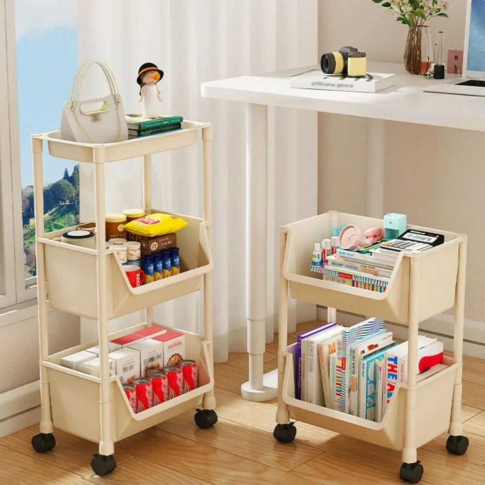 Two beige storage carts with wheels in a room with a desk and window.