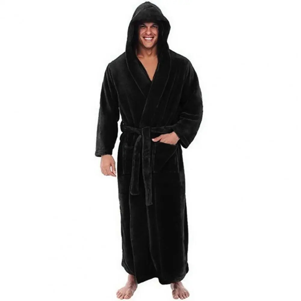Person wearing a black hooded robe on a white background