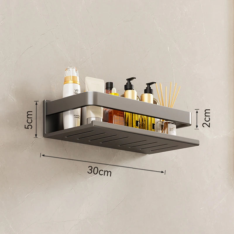 Wall-mounted shower shelf with dimensions labeled on a beige wall.