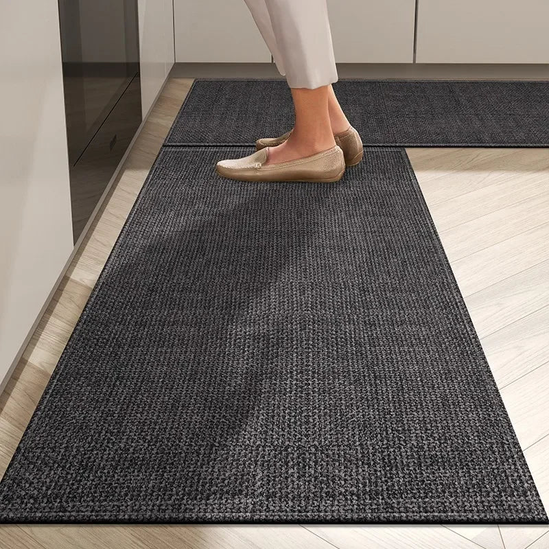 Person walking on a dark gray rug in a home setting