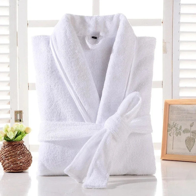 White bathrobe on a white surface with a blurred background