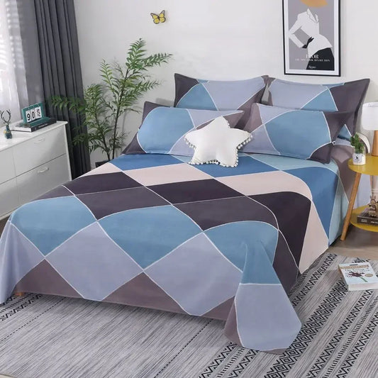 Bed with geometric patterned bedding in a bedroom setting