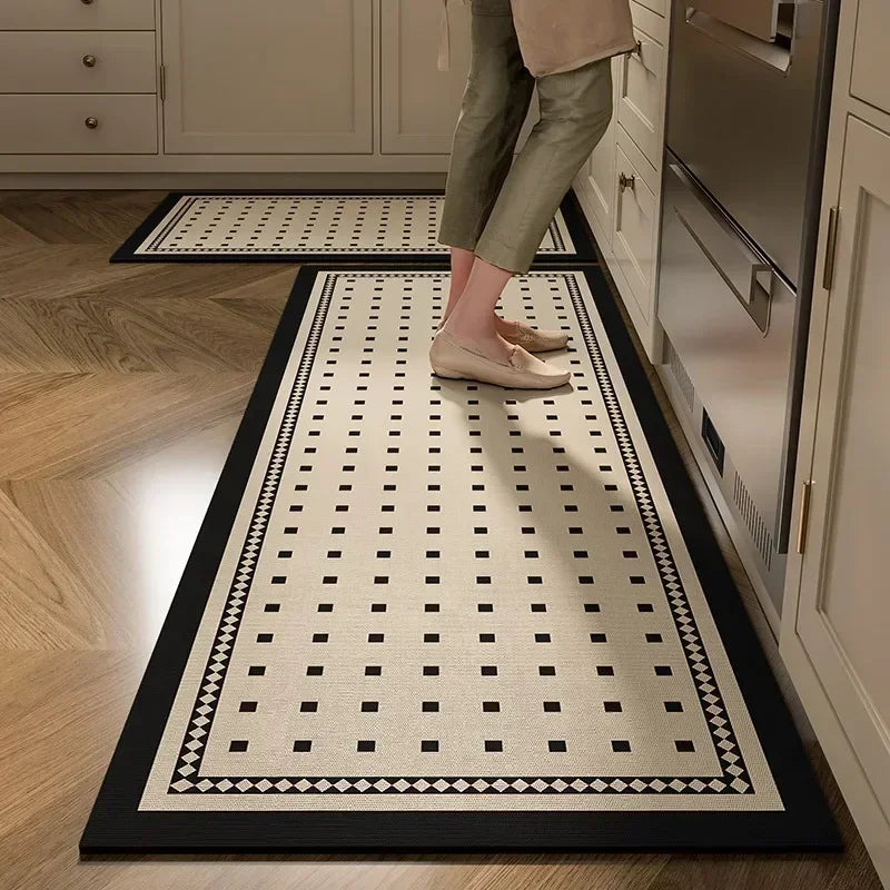 Person walking on a patterned rug in a kitchen
