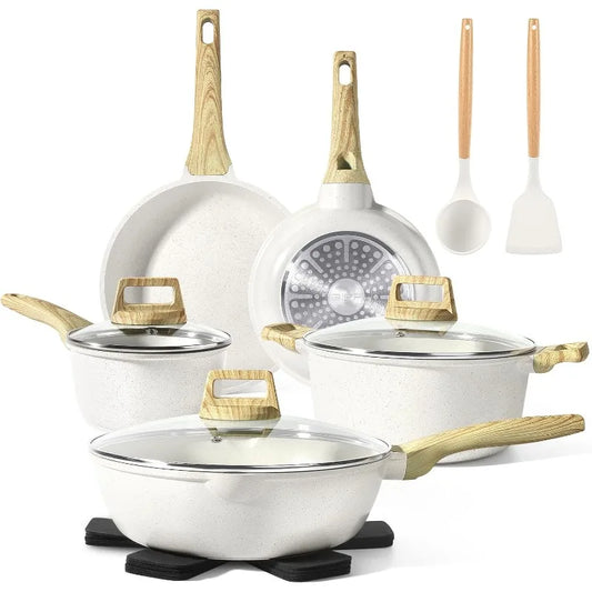 Set of white cookware with gold handles on a white background