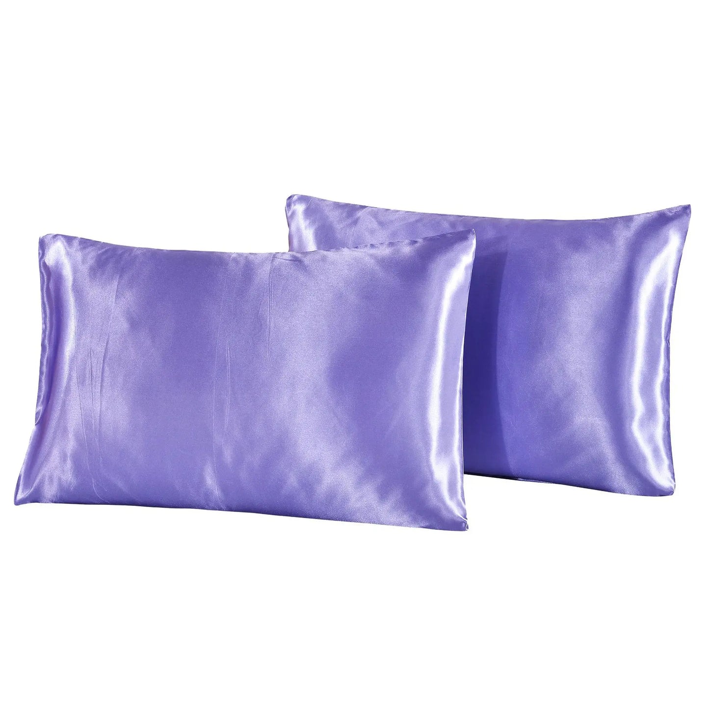 Two purple satin pillowcases on a white background