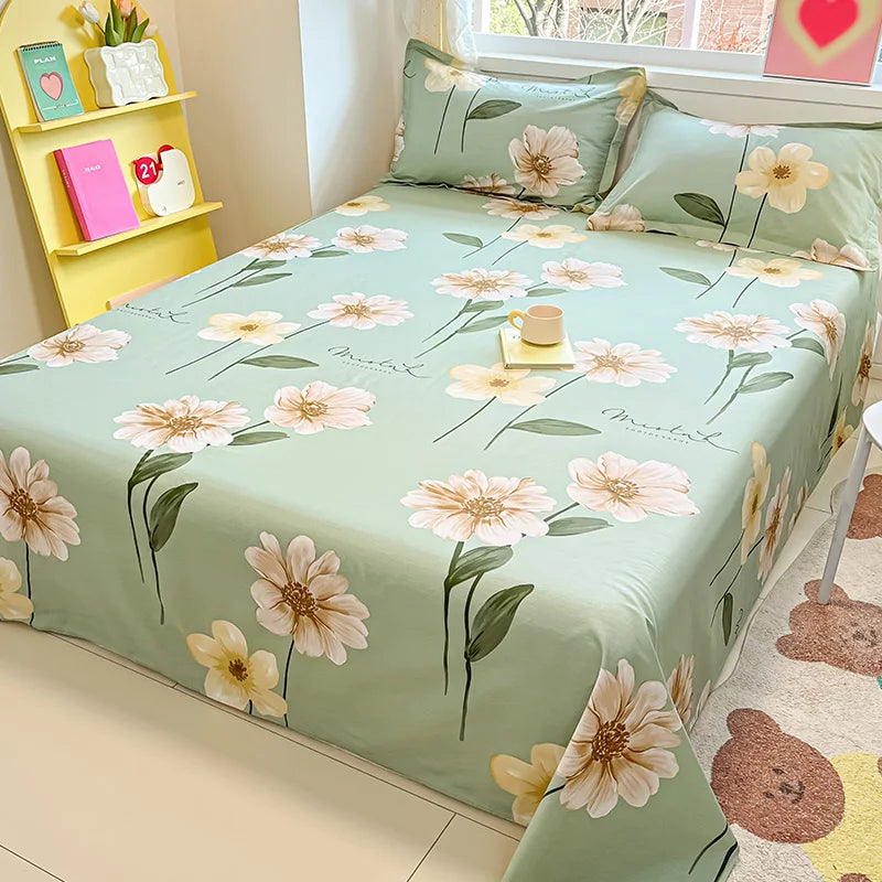 Floral bedspread on a bed with matching pillows in a bright room.