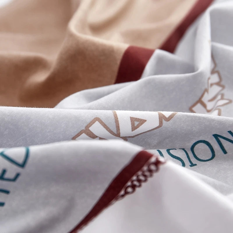 Close-up of a fabric with printed text and patterns, including the word 'VISION'.