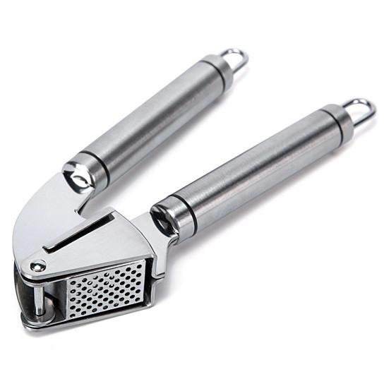 Metallic garlic press on a white background